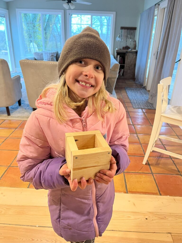 girl with woodworking box