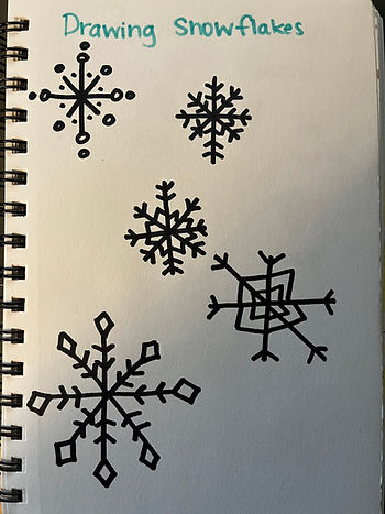 Drawing snowflakes in nature journal 